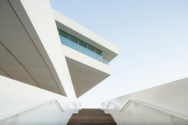 White modern building with clean lines and geometric shapes.